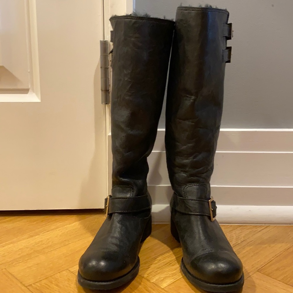 Jimmy choo black boots with fur inside.